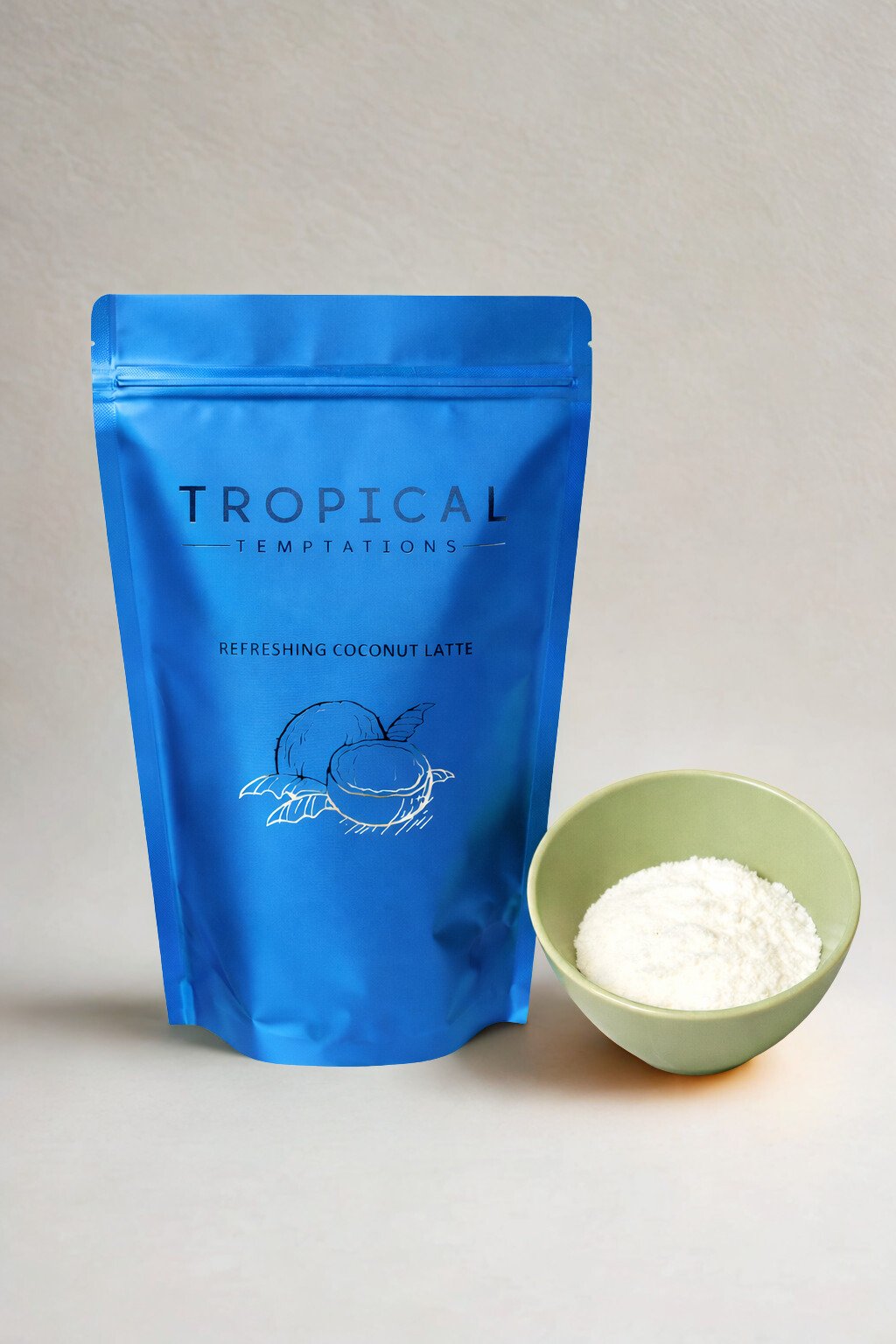 Refreshing coconut latte powder in blue pouch with bowl of white latte powder