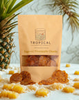 Sugared pineapple chunks in pouch with fresh pineapple and fruit pieces on table