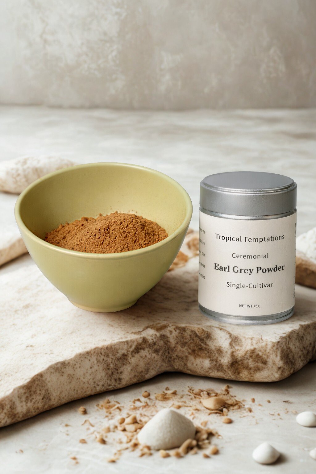 Ceremonial Earl Grey powder in green bowl and tin canister on stone surface, premium latte ingredient