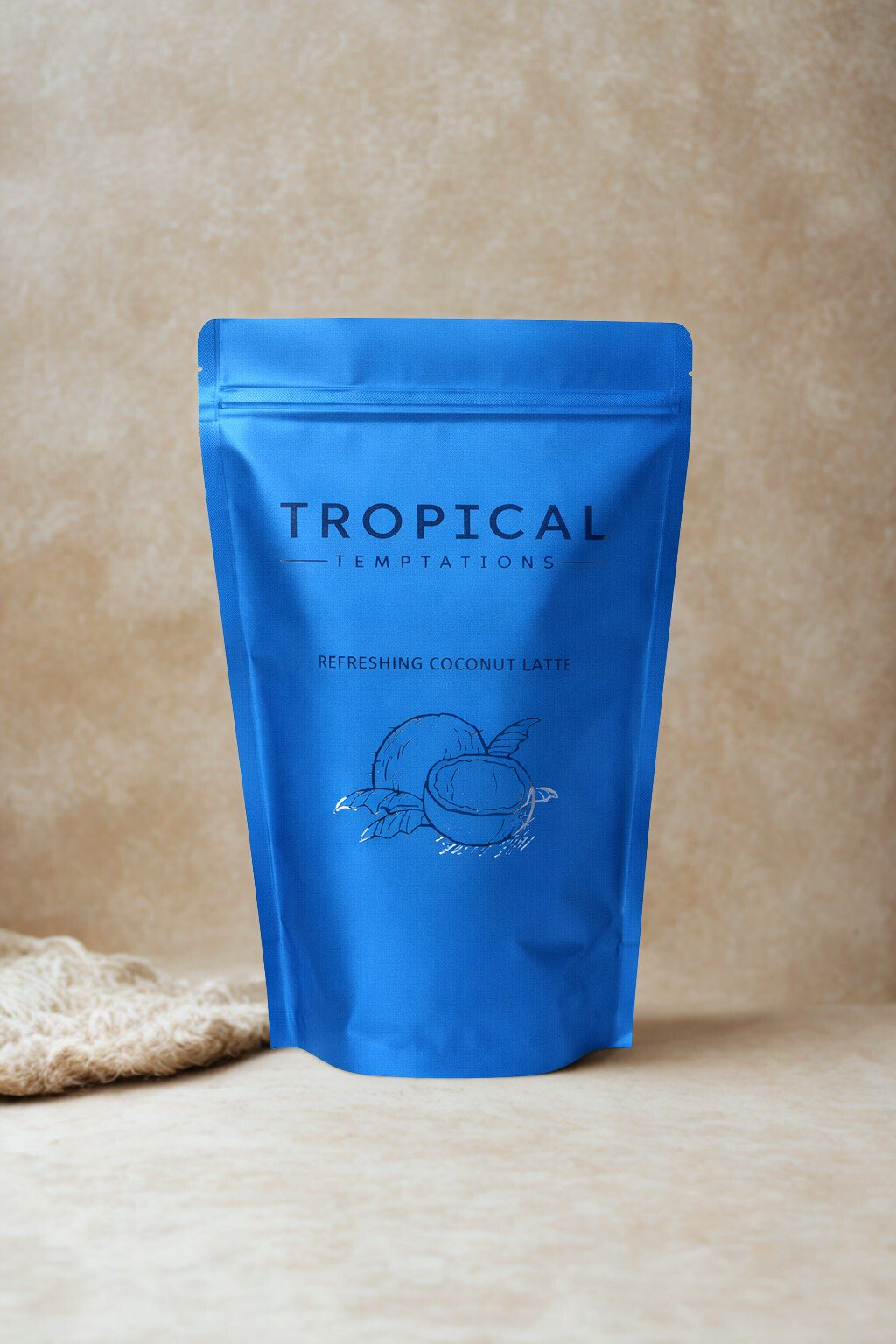 Blue pouch of refreshing coconut latte powder with coconut illustration, beige background